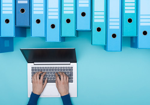 a guy organizing files on his laptop